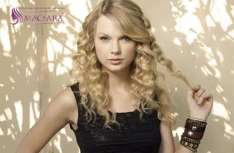 Taylor Swift with long curly blonde hair
