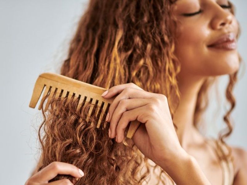 Comb your wavy hair with fingers or a wide-tooth comb