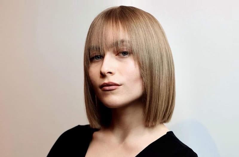 Opt for a sleek bob with bangs for an impressive appearance